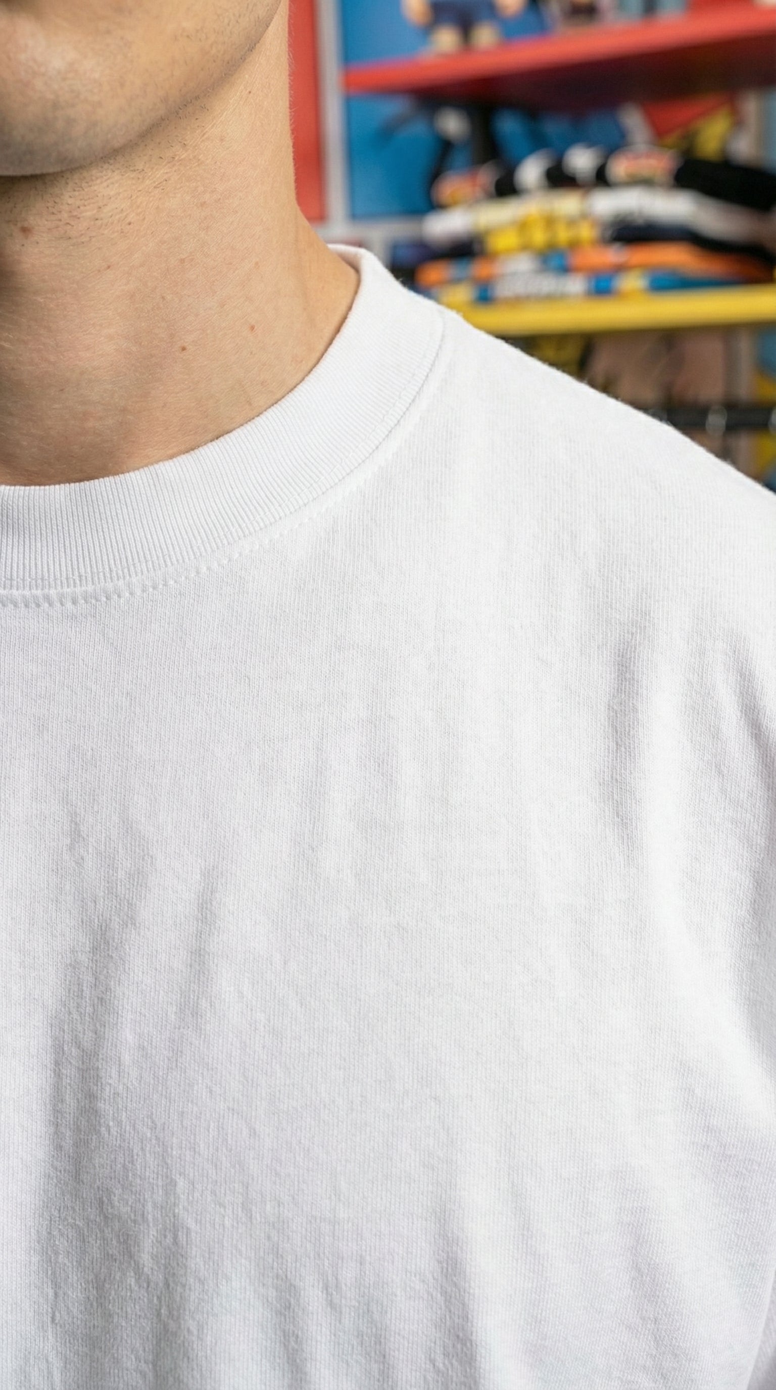 Thick ribbed crew neckline detail on the 280 GSM premium white cotton t-shirt, designed to hold its shape over time.